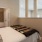 a bedroom with a bed and a lamp