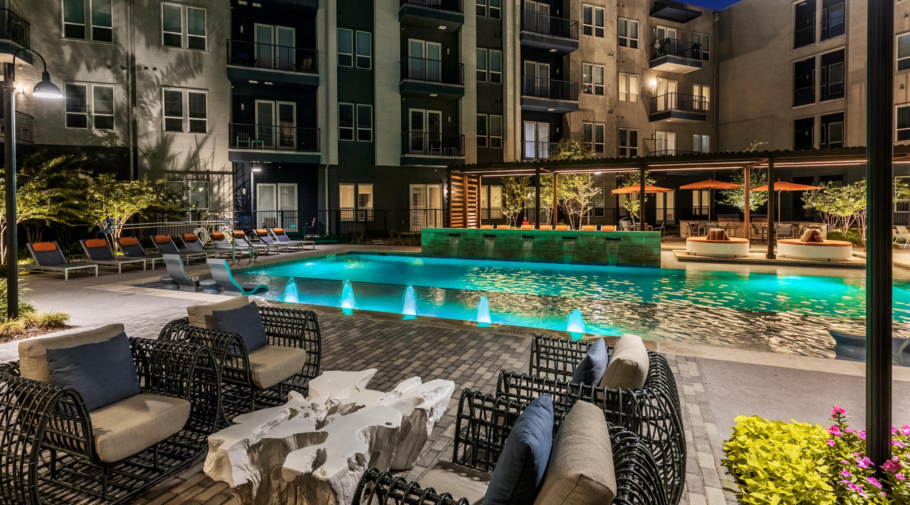 Sparkling swimming pool Resort-style swimming pool with lounge seating