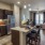 a kitchen with a dining table and a refrigerator